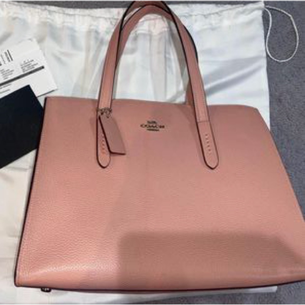 Coach Charlie handbag in pink leather with maroon interior!